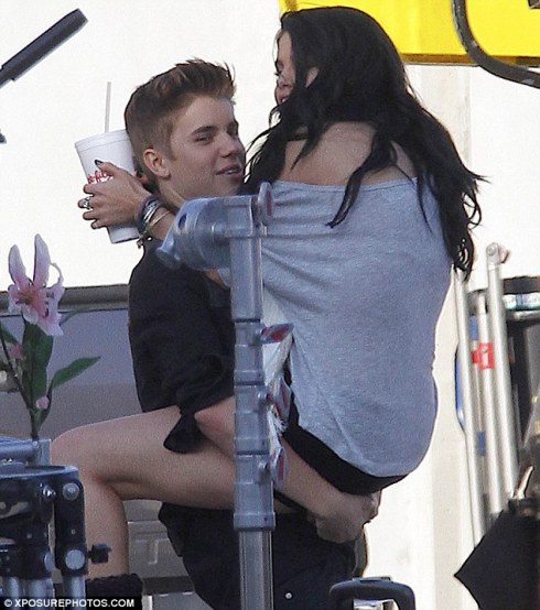 The real thing! Justin looked delighted to be with his girlfriend Selena Gomez on the set of his new video today, he's been using a lookalike to film with  