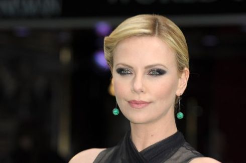 Charlize does a bit of bewitching with her eyes